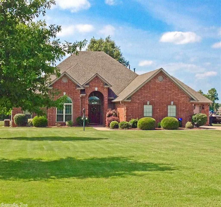 Beautiful brick home on the lake in a quiet country setting. This well maintained 4 bedroom/2.5 bath open floor plan home is move-in ready with new hardwood floors, extensive crown molding, high tray ceilings, large closets, workshop, safe room, and fenced in yard. Enjoy the view of the lake from your screened in porch, or go fishing on the lake and launch your boat from the neighborhood lake access ramp. Live like you are vacationing on the lake everyday, while only 30 minutes from downtown Little Rock!