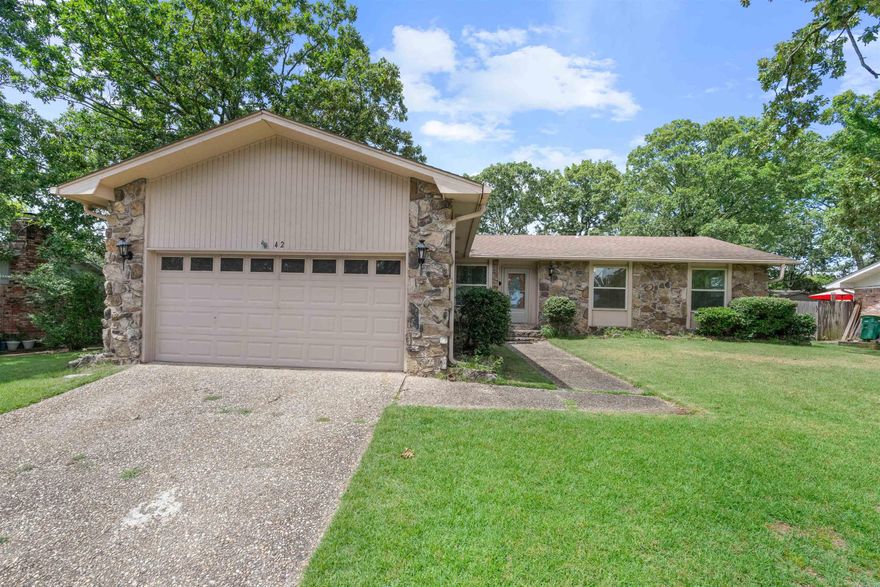 Charming 3 BR/2 BA home nestled in a tranquil, established neighborhood. Adorned with mature trees.The extra large living room can accommodate a dining area or any other needs of the family, and flooded with natural light. The kitchen has an abundance of cabinets with a spacious breakfast bar. Cozy hearth room adjacent from kitchen has rustic rock fireplace. The primary bedroom is generously sized, boasting three closets and direct backyard access. Outside enjoy a fully fenced backyard with a deck and a shop. Perfect for all your family and friends gatherings and barbeques! Conveniently located within walking distance to tennis courts, parks, schools and a scenic walking trail. New roof 7/24. Updated windows and floors and much more! Don't miss this chance to call this house your new home!