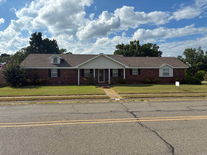 ALL BRICK well maintained home on a Corner lot. Step down living room featuring Vaulted Beamed ceiling, fireplace Hardwood floors throughout living, kitchen and hall and front bedroom, French doors for guests bedroom or office.