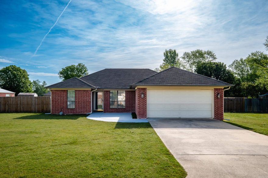 Come see this one-story brick home situated on a spacious .75-acre level lot with a fully fenced backyard and brand-new fencing, offering plenty of space to enjoy the outdoors. A standout feature is the 20x20 enclosed shop with 12-foot covered areas on both sides, ideal for projects, equipment, or additional storage. Highlights that provide peace of mind include a whole-home Generac generator, a new heat and air system replaced in 2024, water heater new in 2025, and roof replaced in 2023.   Inside, the large living room opens to the kitchen, creating a comfortable layout for everyday living and entertaining. The kitchen includes a gas stove with double ovens, a new faucet, and appliances that stay, including a 3-year-old refrigerator.   The split-bedroom floor plan provides privacy for the primary suite, and no carpet throughout the home adds convenience and easy upkeep. Agents, see remarks.