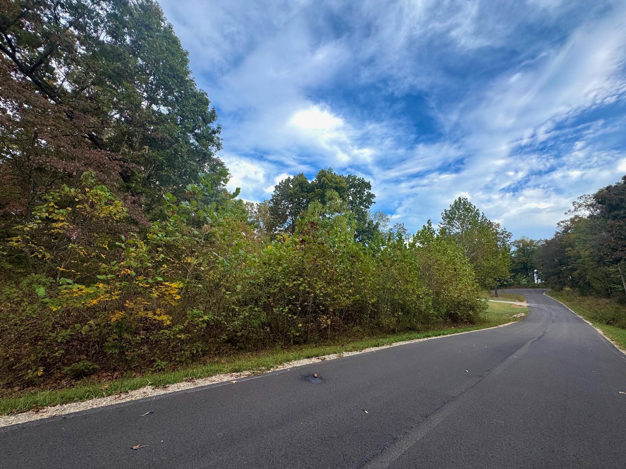 Build your dream home or investment property!- It's a prime lot with utilities and natural beauty. This beautiful, buildable 3+/- acre lot offers the perfect blend of nature, privacy, and accessibility. Water, electricity, and sewer are all underground and ready to connect. The property backs up to a seasonal creek so you can enjoy the sights and sounds of nature right in your backyard. It's nestled in a desirable, well-kept area just two minutes from the highway, with shopping, dining, and local businesses nearby for everyday convenience. There are mature trees throughout the property and surrounding it, so it feels tucked away, but still close to everything you need. Your dream build starts here!