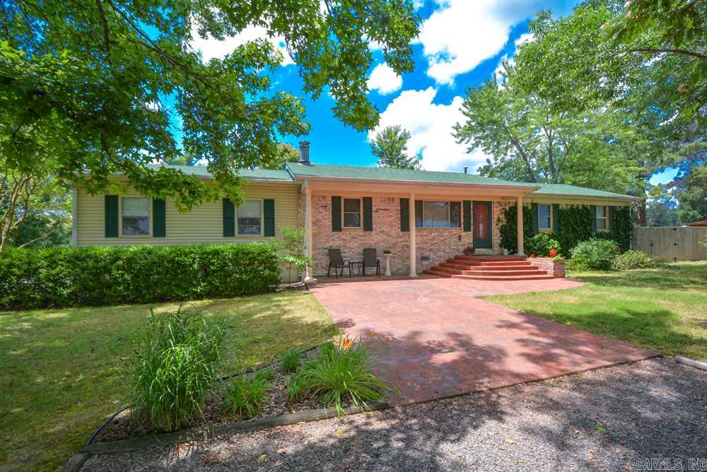Super nice home on 1 acre. Mature trees and extra landscaping surround this well maintained home in quiet area. Pergola covered deck, shop 16x16 with gas & electricity. Interior welcomes you with great room and woodburing fireplace. Open to dining and kitchen. 3 Bedrooms, 2 baths, master bath has a bidet, large master suite. Cabot School bus travels in front of house daily!