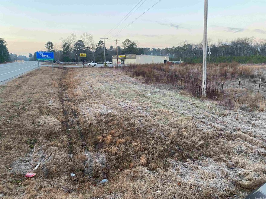 PRIME COMMERCIAL SPOT! Located on Highway 167 next to Dollar General- quick access to interstate! THIS LAND WILL PERC FOR 4 DUPLEXES - that's 8 rental units. 2.68 acres with Dollar General on the south side and the bypass on the north. Level and ready for development. Very high traffic count. Approximately 600' of highway frontage. Call office for copy of new survey.