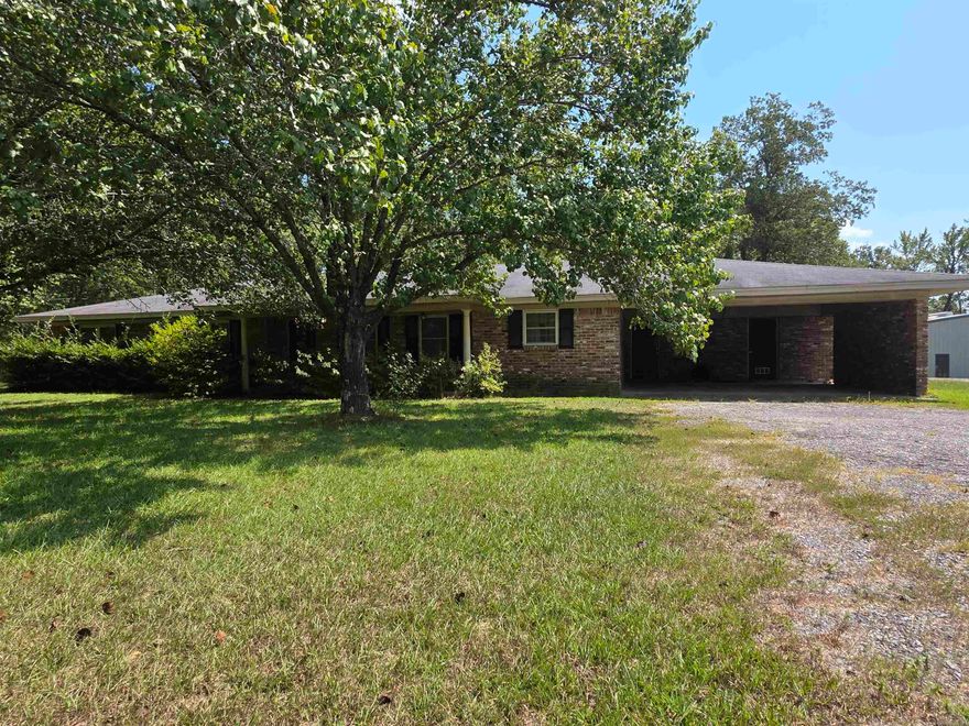 Country living close to town!  This is a very well maintained home with a country flair sitting on a spacious 1.7 +/- acres.  It has a fully fenced back yard and covered back patio.  The rooms are spacious and has an open floor plan.  Plenty of shade here and opportunity for relaxation!  Additional acreage and amenities may be available. Give me a call to take a look. Final acreage and legal description will be determined with a survey prior to closing.