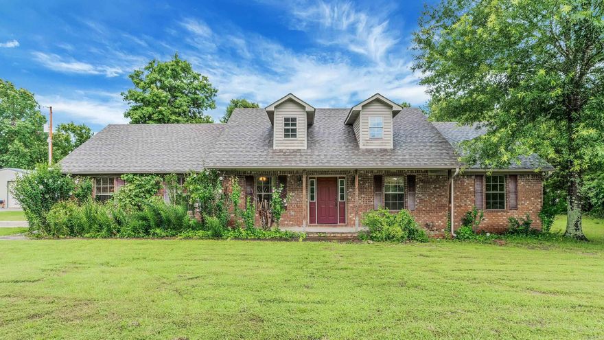 Don’t miss this well-kept 3-bedroom, 2-bath home with an office. The large primary suite features two walk-in closets, a jacuzzi tub, and a separate shower. The living room has a vaulted ceiling, wood-burning fireplace with blowers, and plenty of space for family & entertaining. The roomy kitchen includes a large dining area, that opens to the back porch. The laundry room has built-in cabinets for storage. The attic is floored for even more storage space. Outside, enjoy a covered front porch and a large covered back porch—perfect for entertaining. The home sits on 2.8 acres and includes a side-loading garage, gutters, and maintenance-free exterior. Updates:  Roof (Less than 5 years old) Hot Water Heater (2 years old). Please see agent remarks. Small shed does not convey. Come check it out !!!