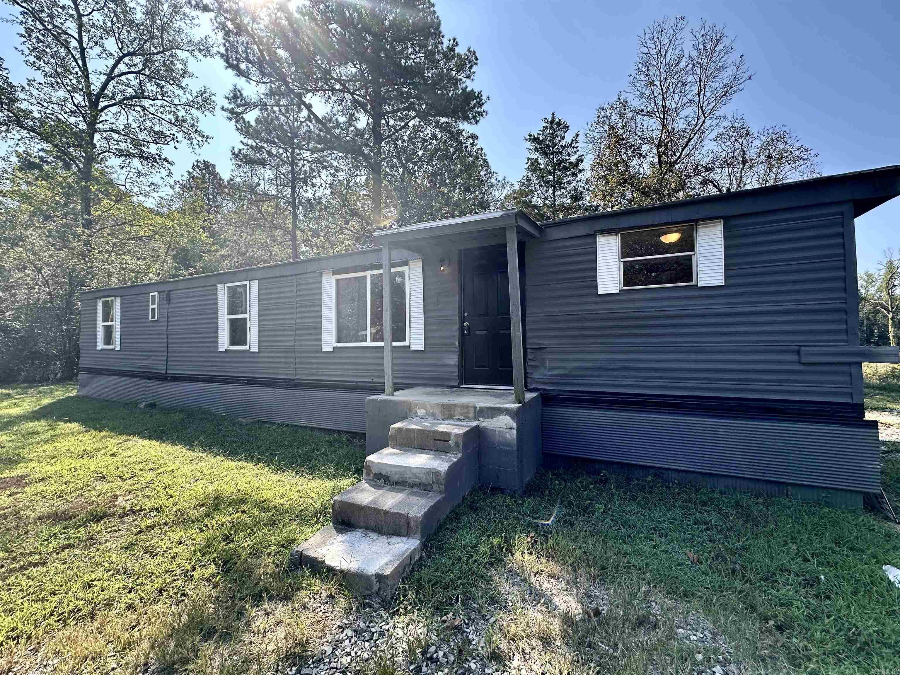Looking for an affordable lake getaway? This charming single-wide mobile home is conveniently located just down the road from Sugar Loaf Marina on beautiful Greers Ferry Lake. Recently updated, this home features new flooring, fresh paint throughout, and an updated bathroom. All the plumbing has been upgraded with PEX piping run in and under the home. Perfect as a weekend retreat, full-time living, or even a vacation rental, this move-in-ready property puts you just minutes from boating, fishing, and all the fun the lake has to offer. Donāt miss this chance to own a cozy spot by Greers Ferry Lake! Check out the virtual tour for a walk through.
