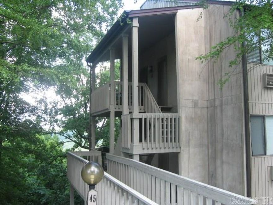 PENTHOUSE LEVEL CONDO WITH VIEW OF GREERS FERRY LAKE AND VALLEY.  This end unit has nice floorplan and a larger deck on the back, and a large entry deck.  A U-shaped kitchen is updated and has nice appliances.  Living-Dining combo with fireplace.  A wall of glass windows & doors provide breath-taking views.  Two large bedrooms & two full bathrooms.  Located just step to Bay View Pool & Cool Pool Cafe, tennis center.  Walk to other amenities, park, shopping, banks, health club, etc.  Come join the good life. AGENT REMARKS