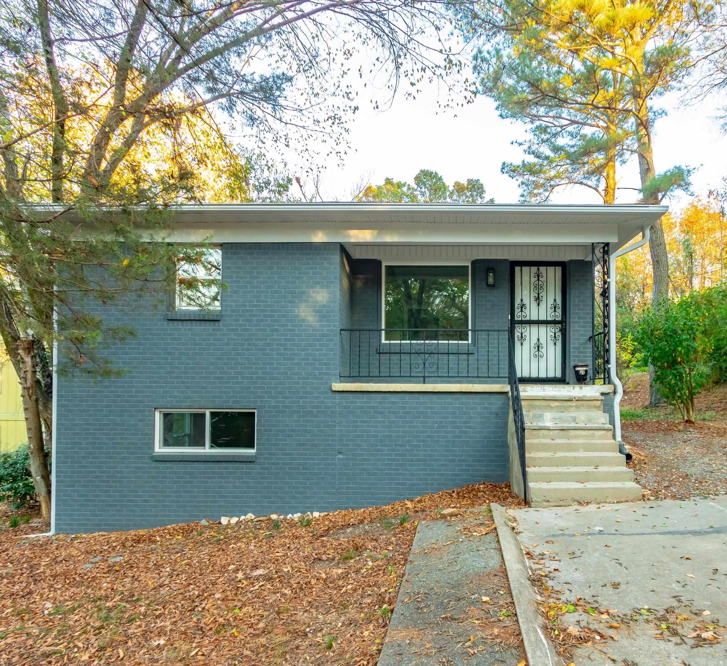 NEW HVAC!! NEW WINDOWS! Discover 107 N Summit, a beautifully renovated Mid-Century Modern two-story home nestled at the end of a street adjacent to a lush green space in the sought-after Hillcrest Union Depot neighborhood! This residence is truly one of the trendiest around, featuring an upper level with not just one, but two inviting living areas, a formal dining space, and a stunning kitchen adorned with exquisite stone countertops and top-of-the-line stainless steel appliances, including a refrigerator, flat-surface range, a Thermador dishwasher, and an eye-catching stainless vent hood! Completing the upper floor is a stylishly tiled bathroom with shaker cabinets and designer accents, a spacious bedroom, and a convenient laundry area. On the lower level, you'll find two additional generous bedrooms, another beautifully tiled bathroom with a shower, and a unique full-door access to your HVAC and other systems, along with a workshop space. Plus, enjoy the convenience of a long driveway for off-street parking!