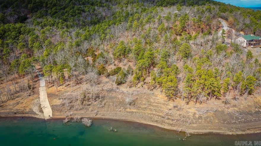 This unique gem is a rare find!! Lake front land ready for you to build your dream home. Property backs up to corp property with a subdivision boat ramp. What more could you ask for. It's a must see!!