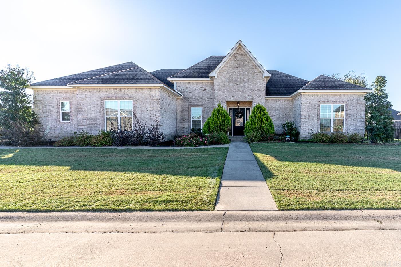 Welcome to 111 Woody Ln in Bay, AR! This 2,058 sq ft brick home on a 0.23+\- acre lot offers 3 bedrooms and 2 bathrooms. The open living area flows into a well-equipped kitchen with a gas oven, built-in microwave, and generous storage. The primary suite includes dual vanities, a large walk-in closet, a soaking tub, and a walk-in shower. This home also offers a large enclosed back porch with a cozy gas starter fireplace-- creates the perfect space for relaxing or entertaining, with beautiful metal fencing around the backyard. Additional features include an instant gas water heater, a spacious two-car garage, and just a few miles to Jonesboro.