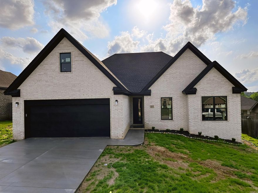 Welcome to luxury living in this brand-new custom spec home! Boasting 4 beds, 2 baths, and an upstairs area perfect for entertaining, this 2200 sqft beauty offers versatility and style. Enjoy a sleek office, perfect for work or study. Revel in modern amenities like an electric fireplace, spacious island with elegant sink, quarts countertops/backsplash, and very tall ceilings with a walk in pantry right off the kitchen. Master bedroom is isolated with a beautiful master bathroom with big oversize bathtub-jacuzzi, massive walk in shower and quartz countertops with two built in sinks and a walk in master closet. 3 bedrooms on the 1st floor and 1 bedroom and office upstairs. Polished concrete floors throughout means easy cleaning and toughest floors you can get! 2 sinks in the guest bathroom with quartz countertops. Luxury vinyl plank upstairs. Located near the country club, convenience meets elegance in this meticulously designed home. Don't miss your chance to experience contemporary living at its finest!  Schedule your tour today!