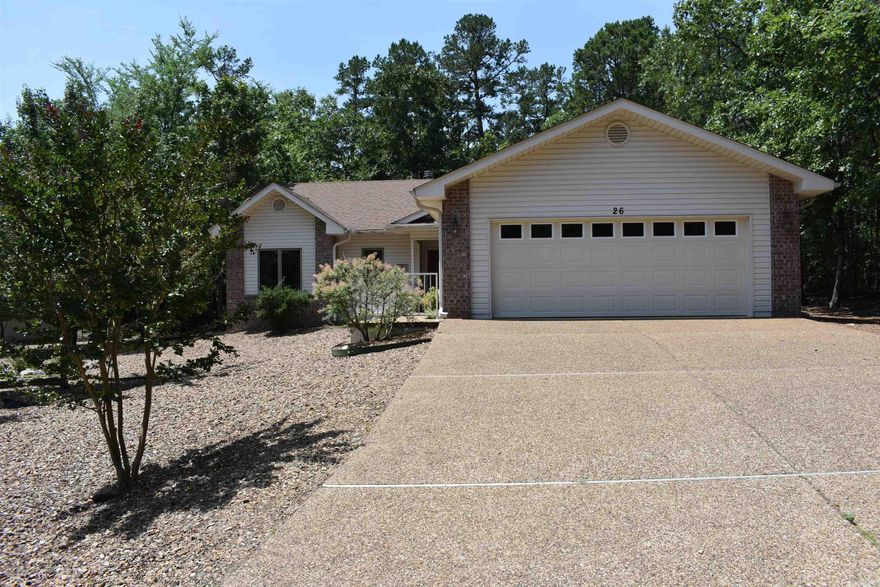 Cute, well maintained home on the East end of HSV.  This 3 br, 2 ba home with large garage is perfect for a downsizing couple, a vacation home, or an investment rental property.  Conveniently located within 10 golf cart minutes of 5 of HSV newest courses and the Lake Balboa Marina & Beach.  Nice sized corner lot that would allow for an additional detached garage with side street entry (with POA approval).  Features include:  Vaulted LR ceiling, gas propane FP, large primary BR, wood laminate flooring in the main areas (no popcorn ceilings).  New roof in Nov 2023, new hot water heater 2022.