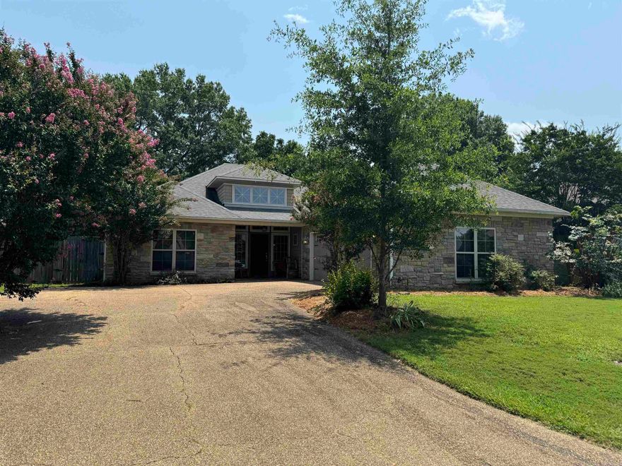 Looking for a home that doesn't feel cookie cutter? Look no further, this Craftsman style home is everything you are looking for.  Enter from the covered front porch into an entryway with 14ft ceiling which leads to a vaulted living area with a beautiful wood plank ceiling, hardwood floors and a double sided fireplace. The kitchen is open to the living room and features an island, stained cabinets, ss appliances and a large breakfast nook.  This home also features a large dining area and second living space with a wall of built-ins shiplap ceilings. Other features include large bedrooms and closets with tall ceilings and amazing trim work, a hall bath with 2 vanities, a master suite with large walk in, sep tub and shower, and a wood wall in bathroom.  Outside you will find a fenced yard, a deck to relax and grill on and a 10 x 16 insulated workshop with electricity! Schedule your showing today!!