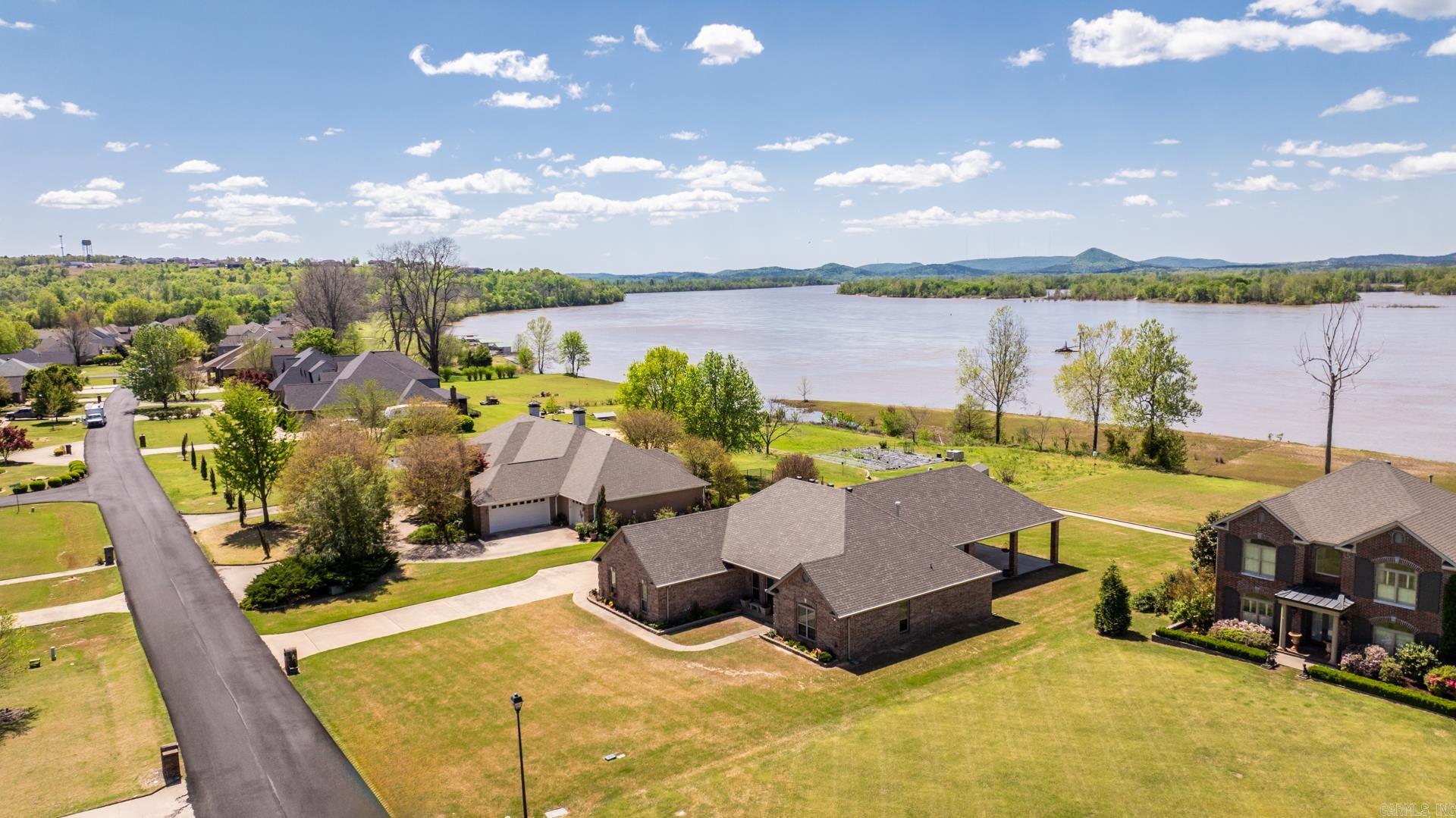 Beautiful RIVERFRONT home located just minutes from Maumelle, in The River Plantation. This one story home has 4 bedrooms, 2 full bathrooms, 2 car side load garage, huge outdoor entertaining space and so much more! You will enjoy your breathtaking views of the Arkansas River, river barges and incredible sunsets! WELCOME HOME!