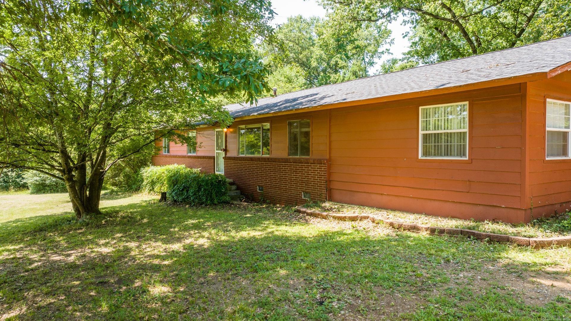 Welcome to your dream home! This 2075 square foot piece of heaven sits on a spacious 4.3-acre lot that is just 5 minutes away from the interstate and around the corner from the highly sought-after Park View Elementary. This beautiful home boasts flat land, off the street, offering you privacy and serenity like no other. Featuring 4 large bedrooms and 3 full bathrooms, this home is perfect for families of all sizes. You'll love the spacious kitchen that comes fully equipped with all your cooking needs. The long circle driveway makes it easy for your friends and family to park and stay awhile. The property is adorned with mature trees that offer a natural shade and a beautiful view that is pleasing to the eye. Don't miss out on the opportunity to own this picturesque property, it's waiting for you! **Agents See Remarks**