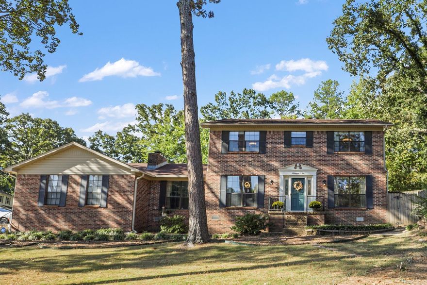 Stunning West Little Rock residence featuring an inviting in-ground pool, situated on a spacious corner lot. 3 Bedrooms up with potential to convert second living area into a ground floor bedroom and walk in closet. This well-appointed home boasts two expansive living areas and a bonus room ideal for a home office or study. The lower level and stairs showcase hardwood floors, while the upper level features new tile flooring. Enjoy open semi-formal dining and a fantastic kitchen with ample pantry space, complemented by a convenient kitchen island for casual dining. Seller is offering a home warranty for buyers.  The home's interior is adorned with built-ins, abundant storage options, a cozy wood-burning fireplace, and elegant crown molding. Noteworthy updates include a 2012 roof, 2018 HVAC units, and fresh paint throughout, extending to the garage. The fully fenced backyard offers privacy and includes a safety fence around the pool. Side garage and access to the backyard from the alley for added convenience.