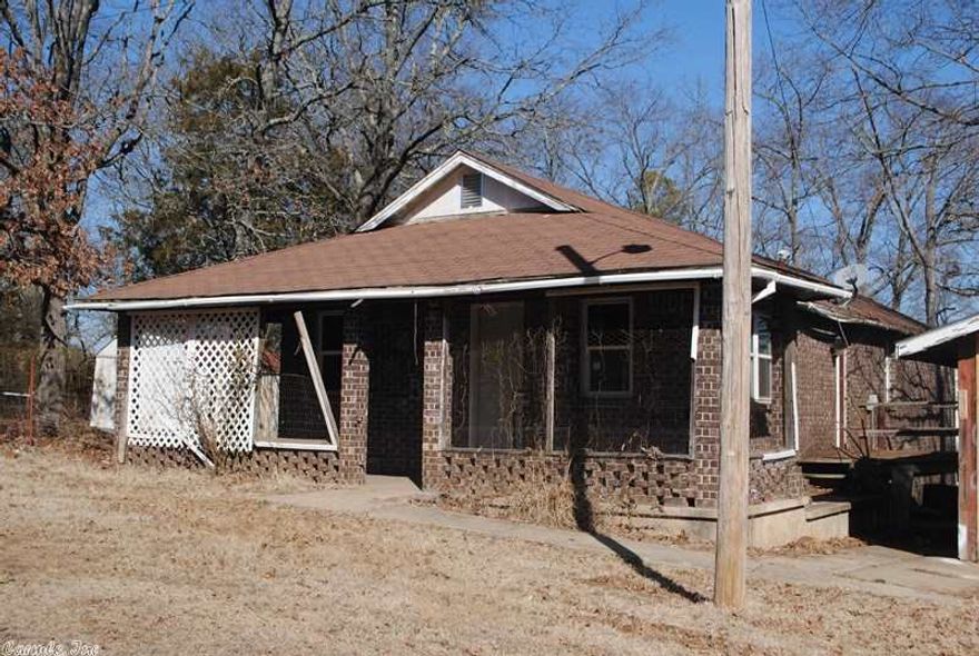 Bank Repo - Fixer Upper. Close to Walmart, Hostpital and Highway 65.  Large yard.  Home has 4th room that could be used as dining room, office or another bedroom.  Home sold AS-IS!  Agents - Please submit attached Addendums with any offers.