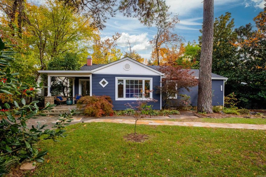 Heights area home featuring classic curb appeal.  The charming facade showcases eye-catching navy blue siding, crisp white trim, and unique diamond and rectangular windows that provide plenty of natural light. A welcoming porch and professionally landscaped front yard offer an inviting outdoor space. Located in the Forest Park School District, this classic mid century home features fresh paint throughout and beautiful hardwood floors on the main level. The inviting eat-in kitchen offers stainless steel appliances and access to a deck overlooking the spacious, backyard—perfect for everyday living and entertaining. The main level includes three bedrooms and 2.5 baths, providing a comfortable and functional layout. The lower level expands your living options with a generous family room featuring a wood-burning fireplace, a convenient kitchenette, and a full bath. There’s also flex space ideal for a fourth bedroom, home office, or guest suite, along with walkout access to a private patio. Move-in ready with room to grow—this home truly has it all!