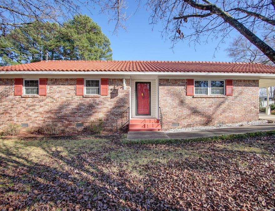 Recently remodeled this home is located in the heart of Hot Springs, close to downtown, shopping & restaurants! New laminate flooringthroughout, freshly painted walls, new dishwasher & refrigerator and move-in ready with a huge fully fenced backyard on a corner lot.Outdoor storage shed conveys to the new owner. Plenty of value in this home....come and see for yourself.