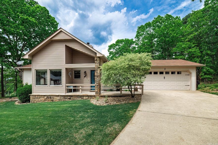 What a cute doll house that was once a model home. Light and bright with beautiful views of the garden back yard.  Updated kitchen with island, cozy fireplace with gas logs, brand new back deck and renovated bathrooms. Both bedrooms have private ensuites. Easy flow home has laundry room near the front door with garage access. Warm and welcoming blue hue color palet on the walls complement the tile, laminte and longpile carpets. Enjoy loving both indoors and out with the perfect grilling deck. A garden like setting surrounds this home.  Best of all is the location.  Easy access to everything at the west gate. Murphy bed and green house negotiable.