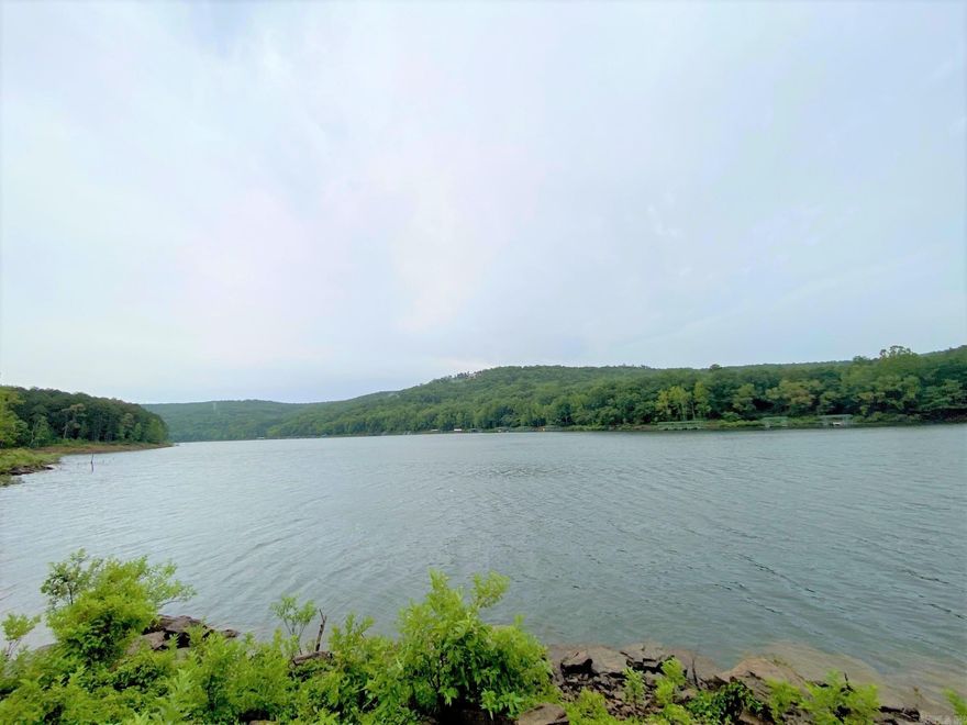 Escape to your own secluded paradise at this enchanting lakefront property on Greers Ferry Lake! Nestled amidst a lush forest of towering trees, this hidden gem offers the perfect blend of tranquility and adventure. Step back in time as you enter the charming, slightly weathered cabin being sold "AS IS" that exudes rustic charm. With its vintage rough appeal and cozy atmosphere, this cabin is a testament to the stories it holds within its walls.  Let your imagination run wild as you transform this humble abode into your personal haven. With its remote setting and excellent fishing opportunities, you'll have the perfect spot to escape to in times of uncertainty. Imagine the peace of mind knowing you have a secure sanctuary surrounded by nature's bounty. While the road to this property may be rough and rocky, it adds to the allure of this remote oasis. A four-wheel drive is almost a must, but the journey is an adventure in itself. Leave the modern world behind as you embark on your own rugged expedition and act now and make your dreams of owning a remote property, whether for relaxation or as a bug out location, a reality! Property does have electricity to it.