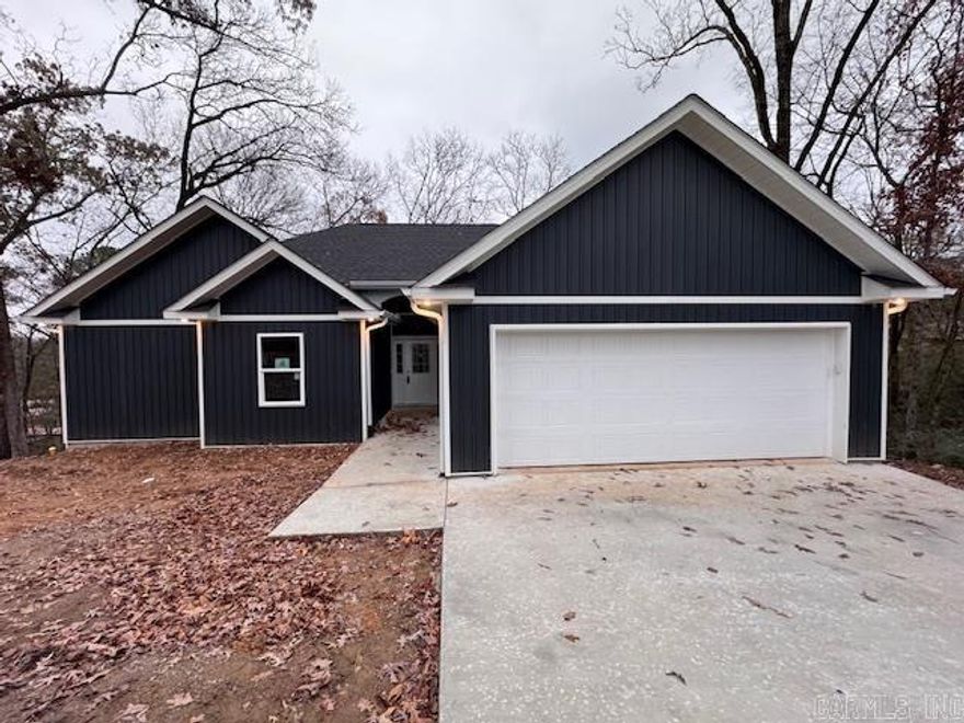 Wrapping up the Final Clean and Landscaping on this New Build in the Heart of Hot Springs!  Situated on a Large, Beautiful Lot, this Home features an Open Floor Plan with Lots of Glass to take in the Wooded Views, a Spacious Kitchen w/ Center Island and Beautiful Pendant Lighting, Quartz Countertops + a Pantry!  The Split Floor Plan offers a Private Primary Suite with a Huge Closet and a Large Custom Tile Shower.  The Guest Bedrooms have Great Closets!  Nice Central Laundry Room.  Covered Back Deck!  Oversized Garage!  You will love the Convenient Location and Quiet Neighborhood!