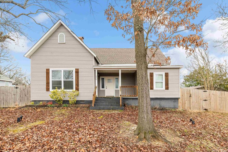 This stunning completely remodeled home in the heart of downtown Benton sits on over an acre, offering the perfect blend of modern comfort and convenience.  Inside, you'll find 2 spacious living areas, a stylish mudroom, and beautifully updated finishes throughout. Step outside to enjoy the large yard and relax in the above-ground saltwater pool. New electronic gate and dishwasher installed. With plenty of space to entertain and unwind, this rare find combines city living with the privacy of a large lot.