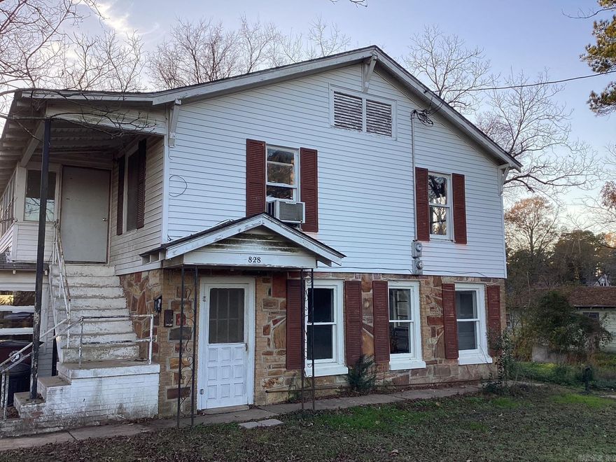 Two-story duplex in Prescott, Arkansas offering a great opportunity for investors or buyers looking for a renovation project. This fixer-upper features two separate living units and plenty of potential to customize or modernize. With repairs and updates, this property could serve as a long-term rental, multi-family investment, or resale opportunity Plenty of parking around the building with a concrete slab for outdoor grilling. Within walking distance to Kofield cafe. See agent remarks