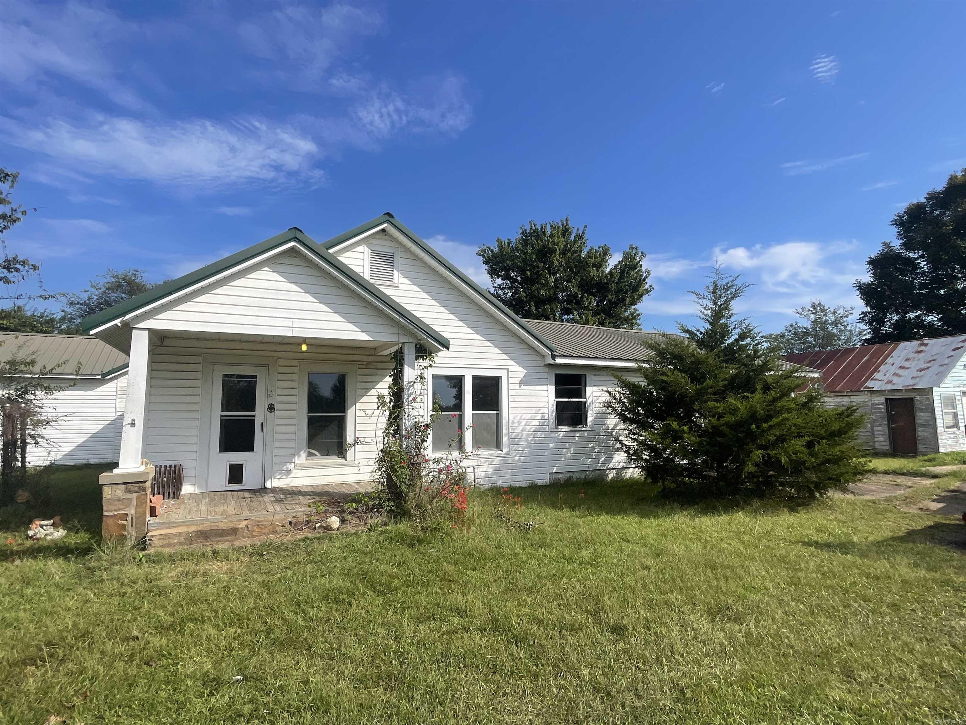 Looking for space, privacy, and a project you can truly make your own? This spacious fixer-upper is packed with opportunity and value! Sitting on 1.5 peaceful acres, this property offers over 1,500 sq ft of living space, a 2400 sq ft shop, a detached garage, and all the potential to become your dream home or investment property. Agents see remarks.