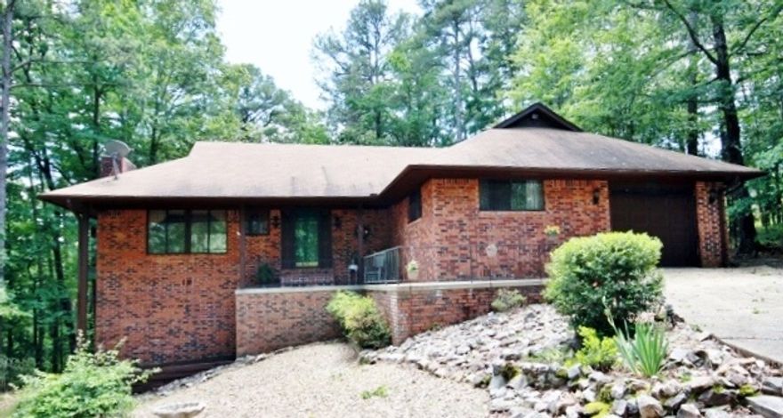 Private well-kept Home! 2 Decks overlooking inviting shaded back yard with beautiful landscaping. Some 2012 updates: Buck Stove insert; Tiled Kit counters & backsplash; Dbl Kit sink & faucet; Int. & Ext. Paint; some light fixtures. Other features: sun tubes; built-ins; dbl vanity in MBath; large storage/workshop in CS; ceiling fans; walk-in closet.