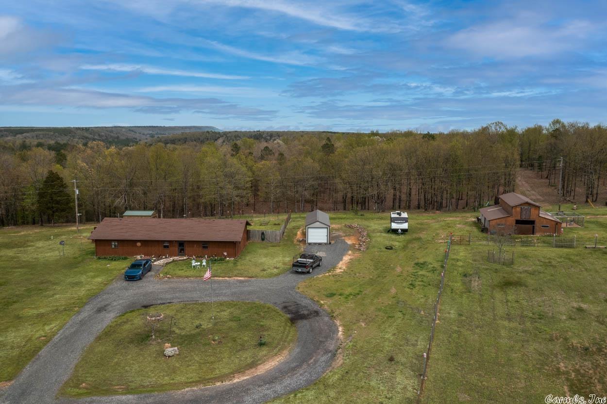 Looking for a beautiful, spacious home surrounded by nature? Look no further than this stunning ranch-style home situated on 32 acres of scenic land! As you step inside this charming home, you'll be greeted by a warm and inviting atmosphere. With 3BR/2BA + office, and an open-concept living and dining area, there's plenty of room for everyone to spread out and make themselves at home. Comes with solid surface counters & a Ben Franklin Wood Burning Stove. Has two water heaters and comes with 32x15 Half covered deck, barn is 32x36. But the real star of the show is the land outside. Whether you're an outdoor enthusiast or simply love to take in the beauty of nature, this property has something for everyone. The 32 acres of land provide ample space for hiking, biking, horseback riding, hunting and more. It has a small off-grid hunting cabin with a deck with an amazing view at the back. You'll love relaxing in your wooded paradise and taking in the stunning views of the surrounding countryside. $3000 flooring allowance offered! Don't miss your chance to make this dream home a reality. Contact us today to schedule a viewing!Agents be sure to reference confidential remarks.