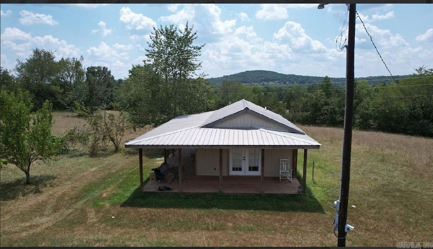 Tiny house living at its finest. Check out this wonderful cabin nestled on ten acres. Enjoy the peace and quiet while relaxing on the porch. Watch wildlife roam through the pasture. Plenty of room for livestock to roam. The best part of the property is the access to Pee Dee Creek which connects to Greers Ferry Lake. You won't find a better place to call home.