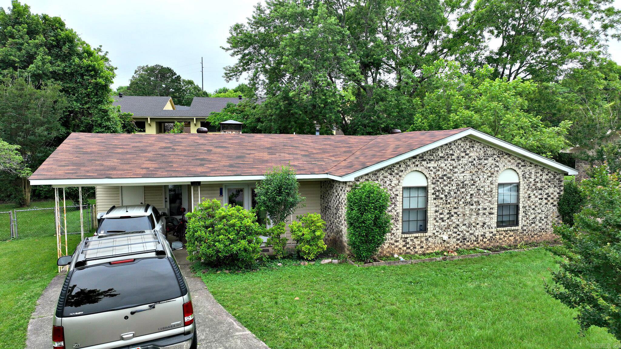 Nestled on a cul-de-sac in the heart of Mena, Arkansas, this charming 3-bedroom, 1.5-bath home offers both comfort and convenience. With a brand-new roof installed in 2025 and a new HVAC unit from 2024, this property is move-in ready and full of potential—currently used as a rental, it’s an ideal investment opportunity or perfect for a personal home. The spacious living room features a cozy wood-burning fireplace, creating a warm and inviting atmosphere, while the sunroom adds extra space for relaxation or entertaining. Outside, you’ll find a fully fenced backyard with a storage building, providing plenty of room for hobbies or pets. Located just minutes from local schools, shopping, and dining, this property truly combines a peaceful neighborhood setting with the convenience of in-town living. Don’t miss your chance to make this wonderful home yours! Refrigerator in Kitchen belongs to tenant. Refrigerator in the sunroom stays with home.