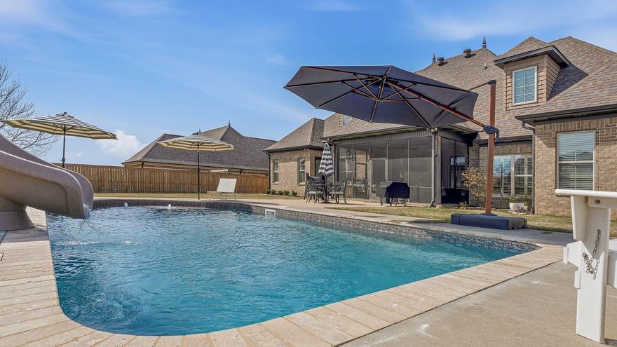 It's almost pool season! Check out the luxurious travertine lined heated & chilled pool at 4309 Weldon Lane! Pool features include a slide, lights, bubblers, pool deck, umbrella holders, and a new liner. The sizable screened-in back porch upgrades this back yard living to the next level too. The two story stone and brick exterior is beautifully designed and accented with extensive landscaping front and back. Inside you'll find hardwood floors in the main living areas, herringbone patterned stone in the kitchen, granite throughout, and ceramic tile in the baths. The property boasts a dining room, butler's pantry, stone fire place, generous office, breakfast bar, 4 beds, 3.5 baths, walk-in closets, oversized bonus room, two attics, and two garages. The 21 foot ceiling and arched balcony opens up the living area creating a spacious feel to the home. Key updates to the home include new kitchen back splash & stone floors, a new driveway, new paint (color drenched), custom wall paper, new lighting, custom window treatments, window tinting, & plantation blinds. The primary en suite is a must see complete with a soaker tub, walk-in shower & closet