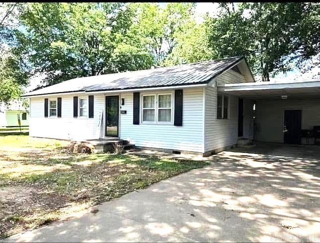 Located close to schools and shopping, this older home has lots of character with many updates. The flexible floor plan has 2 living areas which could be used as family rooms or formal living and dining. The kitchen has updated appliances, freshly painted cabinets, new lighting and fixtures, and tile flooring. A dining area adjoins the kitchen, but could also be used as a holding room. Both baths have new lighting, shower rods, tub/shower, mirrors, and primary bath has a new toilet. All bedrooms are spacious and have nice closet space. A large pantry is in the family room on the back of the house. The back yard is fenced and ready for your kids or dogs to enjoy. The 1 car carport has a new roof and features a storage room with laundry room and lots of shelving. There is also a new breaker box and water lines to the street.
