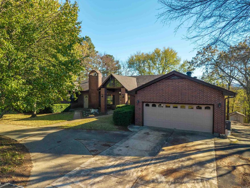 This 7 Bedroom 5 Bath home is perfect for a large family or multi-generational living.  The main level features the primary bedroom and ensuite bath and a guest bedroom and a full bath, kitchen, separate dining room, a large family room with one of 3 gas fireplaces, as well as an office and laundry room.  there is a large deck overlooking the private back yard with partial lake views.  the lower level has 3 bedrooms, 2 full baths an office, dining family room combo and a kitchen with a large island.  This level has a laundry room with a gas or electric dryer hook up. There is access to a patio and the back yard om the lower level. The separate entry mother-in-law suite has 2 bedrooms, one bath and a kitchen, dining, living combo. There is access to the back deck as well.  There are two 40-gallon gas water heaters and 3 HVAC units.   Arzella Acres is a private subdivision with secured entry and lake access.  POA dues are $50.00 a year.  Call me to see this very special home today!