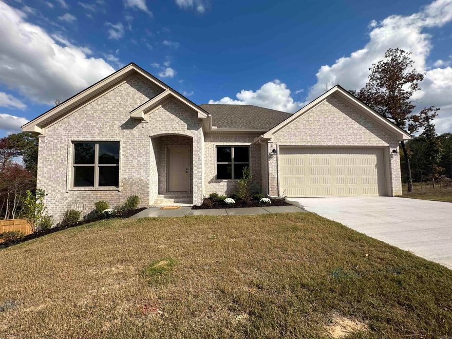 Seller allowing up to $7500 toward buyer closing costs or financing options.. New Construction in Pinewood Estates. Living area has 10' ceiling , wood burning fireplace & is open to kitchen & dining. Kitchen has custom cabinets w/ez-close drawers, granite counter-tops & s/s appliances. Crown molding in all rooms. Hardwood floors in LR, kitchen, dining, & hall. Ceramic tile floors in baths & laundry. Split floor plan. Primary BR has tray ceiling. Primary bath has sep. shower, soaker tub, & large closets. Laundry room w/storage. Approx 0.81 acre lot. Possible storage in Crawl space. Bryant Schools. AT&T Uverse available at street or Connect2First internet options.  AGENTS SEE REMARKS!