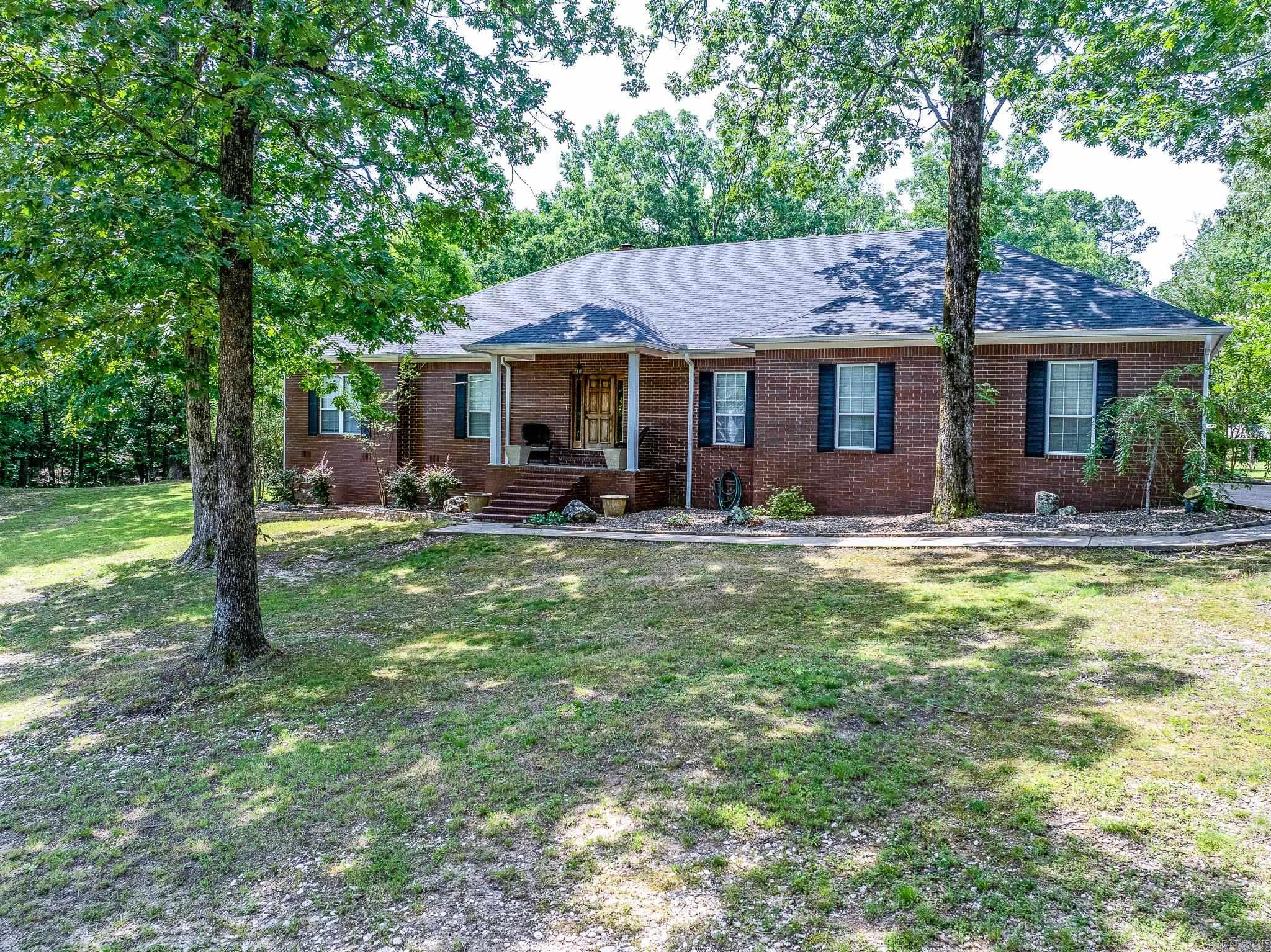 Beautiful drive - only 8 miles from I-30 to this private setting. This stately home was built with family in mind. Fabulous neighborhood with acreage tracts and ponds for the rural setting with neighborhood covenants to protect your investment. All brick home on 3.21 acres featuring free-form gunite heated pool. Huge 35' x 25' greatroom/dining features wood-burning pellet stove with temperature settings. Kitchen has stainless appliances & breakfast area. Large office or formal dining room off front foyer. Covered patio opens to beautiful salt water pool with waterfalls and built in jets. Oversized 3 car garage with ample storage space. 20kw back-up (propane) generator will run the house and back up pool operation. Pool can be heated by propane also. Roof is 7 years old! **This is a Relocation Sale** Must present preapproval if financing. There will be relocation addenda to sign with offer.