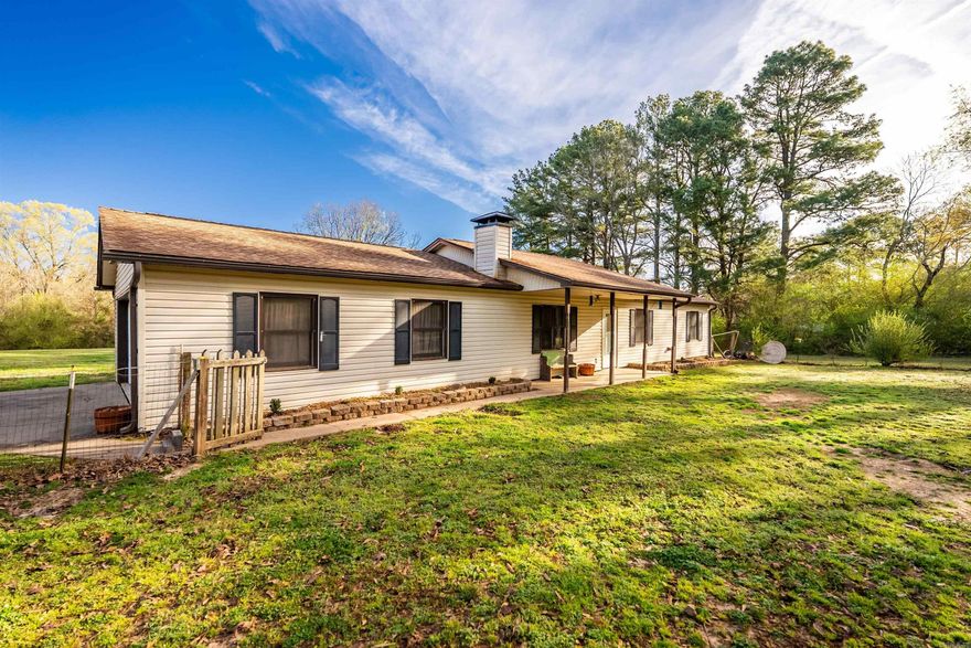 This charming 3 bedroom, 2 bath home is perfectly situated on 21 acres behind the Little Rock Air Force Base. Once home to livestock and horses, the property features a naturally fed creek, a small pond, and winding trails that make you feel like you're in the heart of a private forest. There's a beautiful pond that attracts deer with old fencing for livestock. At the front of the property is a fenced in yard for pets and new flowerbeds! Inside, enjoy the modern touches to the new paint, new ceiling fans and updates to the bathrooms. A wood-burning fireplace insert and custom wooden frame windows add so much character to this beautiful homestead. Parcel 21R0360005800 separated into 17.19 and 3.84 acres.