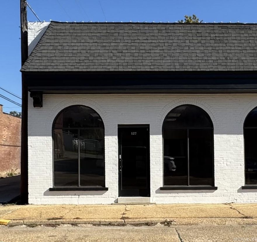 127 W. Main Street is a turnkey commercial building located in the heart of Piggott, AR. This well-maintained brick building offers approximately 1,040 sq feet of functional business space and sits on a 1,600 sq ft lot. This property features a modern storefront, with excellent visibility, located on Historic Main Street. The open interior layout provides plenty of flexibility to design your ideal business set up- whether it's a welcoming showroom, professional office, or customer service space. This property combines small-town charm, low maintenance operation, and street parking available directly in front. High foot traffic from nearby shops, restaurants, and community spaces adds to its appeal. Call or text me today to find your next business venture or investment.