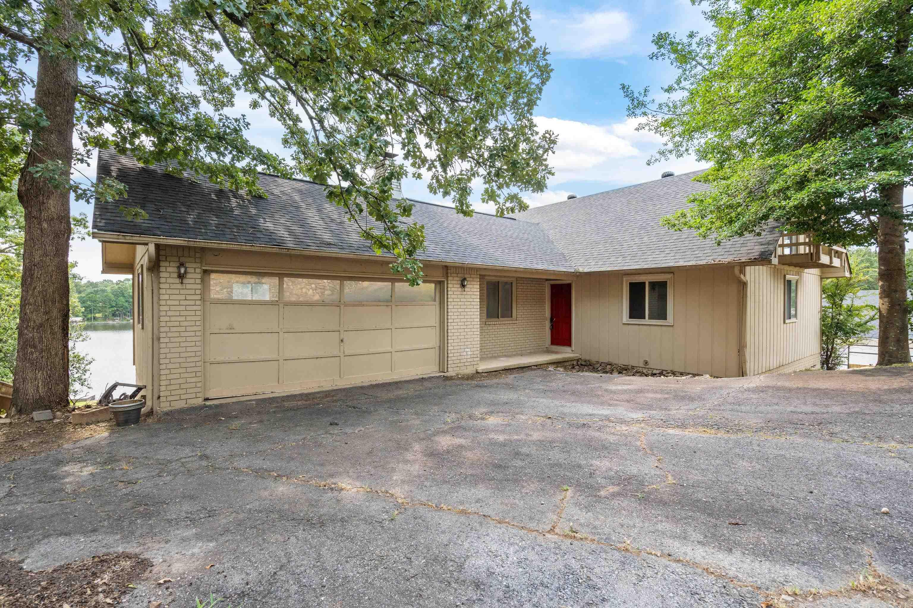 Run don't walk to this lakefront home! Come put your touches on this home. The main level has an open floor plan with the primary bedroom and laundry. Upstairs you will find 2 bedrooms and a full bathroom. There is also a full unfinished basement and the possibilities are endless. Enjoy time spent on the deck overlooking the lake and there is a boat dock. The views of the lake are amazing.