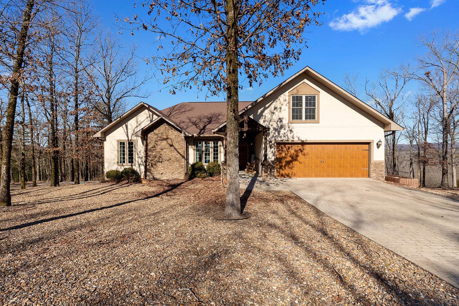 STUNNING VIEWS of the Ouachita Mountains, Lake Catherine, and downtown Hot Springs! This incredible home is packed with features you won’t want to miss. Walls of windows flood the interior with natural light, offering breathtaking views. The open-concept living, dining, and kitchen area with soaring cathedral ceilings is perfect for entertaining. The spacious primary suite includes a safe room/closet for added peace of mind. Hand-scraped wood and tile floors throughout, plus an upstairs bonus room that’s ideal for an office, game room, or hobby space. All this sits on a serene and private 1.94-acre lot in the highly sought-after Lakeside School District. Opportunities like this do not come around often, do not miss your chance to own this one-of-a-kind property!