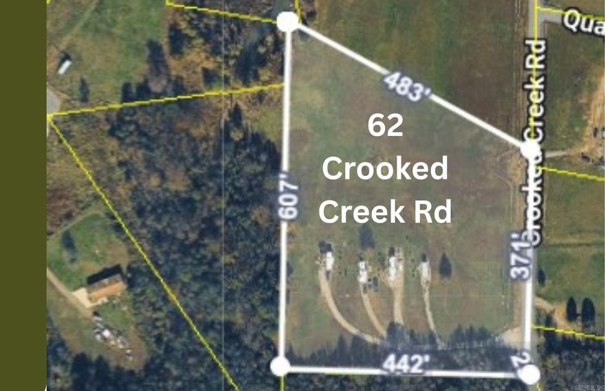 5 Acres with income producing RV Park This property is equipped with a gravel drive and 4 RV spots that include hook-ups to a common septic system, and each RV spot has a 50 Amp plug. Purchase as-is or purchase the adjoining acreage to expand.