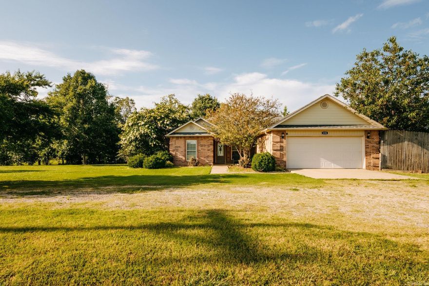 Looking for space to spread out and a pool to cool off? This one-level, 3 bedroom home offers 1520 sq ft of comfortable living space on one acre, complete with an inground pool and a brand new liner (2025). The open-concept kitchen includes a generous pantry, breakfast bar, and a dining area with room to gather. The living area features tile flooring and a cozy fireplace. A split floor plan provides privacy with a spacious primary suite, including a walk-in closet, soaking tub, and separate shower. Outside, enjoy a backyard designed for relaxing and entertaining-covered deck, pergola, large yard, and a storage building for all your extras. Plus, don't forget the FEMA-approved safe room in the garage. This is a perfect home for a growing family. Don't snooze on this one! It'll be here and gone. Schedule your showing today!
