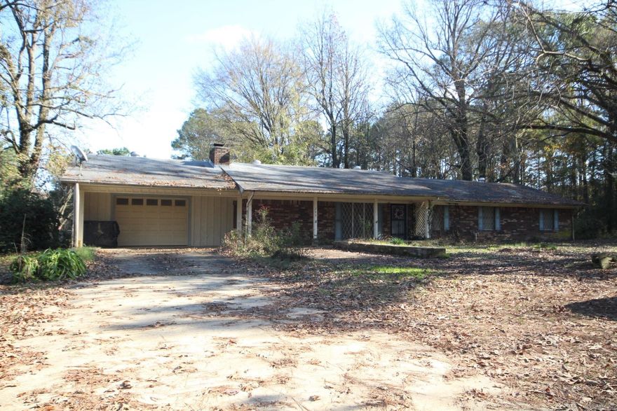 4 Bedroom, 2 full baths with approx. 1848 Sq. Ft. of living space situated on approx. 2 acres.  Kitchen has great storage (Refrigerator conveys.)  Family area features wood burning fireplace.  Spacious laundry area with great storage.  Covered patio (backporch).  Property has a 26 x 42 shop and a 20 x 32 greenhouse.