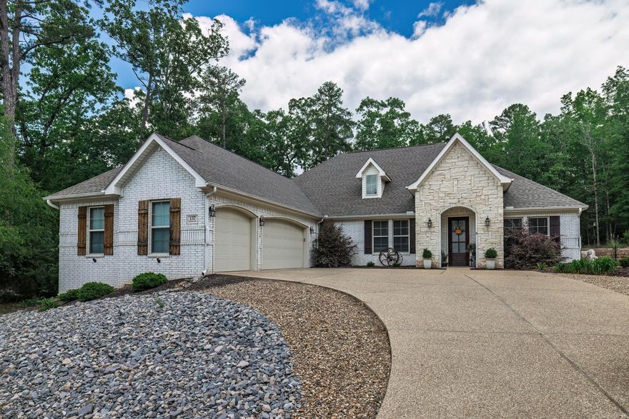 What new but don't want to build it? Now is your opportunity to walk in to this stunning home!  The vaulted great room is open to kitchen and dining area with walls of windows bringing in lots of natural light. Crown molding throughout the home. Chefs kitchen with gas range and double ovens make entertaining a breeze. Enjoy the large walk in pantry. Dining room with tray wood ceiling. Great room has stone fireplace with built ins. Spacious primary bedroom and bath with walk in shower, jetted tub, two sinks and a large walk in closet. Laundry convenient to the primary with additional sink. Two additional bedrooms in the divided bedroom plan with convenient guest bath. Half bath located just off the garage area. Side load three car garage with floored attic storage above. Step out back to your private fenced oasis and enjoy the tranquil setting with additional landscaping. Close to the East end amenities. This one is truly move in ready! New property owners have a $2000 buy in fee payable at closing. NO SIGN! AGENT REMARKS