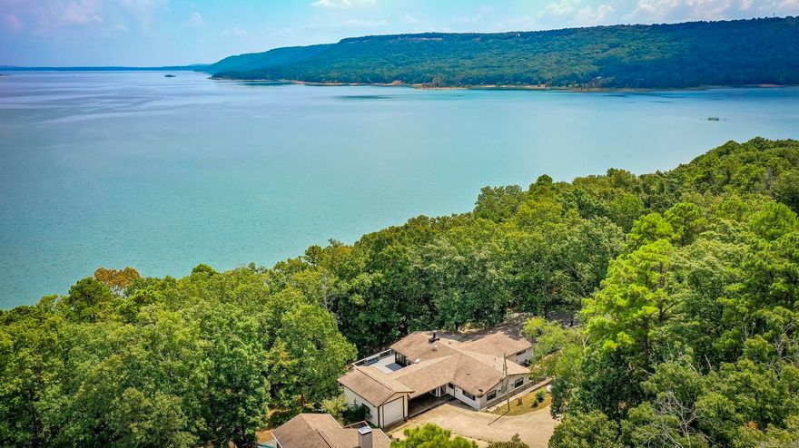 Lakefront home on the beautiful Greers Ferry Lake with easy walk to water!!!!!! As you approach you will be greeted by the ultra-low maintenance exterior finishes. Fresh outdoor paint and deck, -New A/C Unit & Ductwork!! - Inside, a spacious and inviting floor plan with approximately 2,472sf of thoughtfully designed interior spaces that will knock your socks off! The generously proportioned interior flows effortlessly from the open-plan living space to the private screened in porch and rear patio perfect for family gatherings! All of this situated in a convenient, friendly neighborhood. Call today to schedule a private showing!
