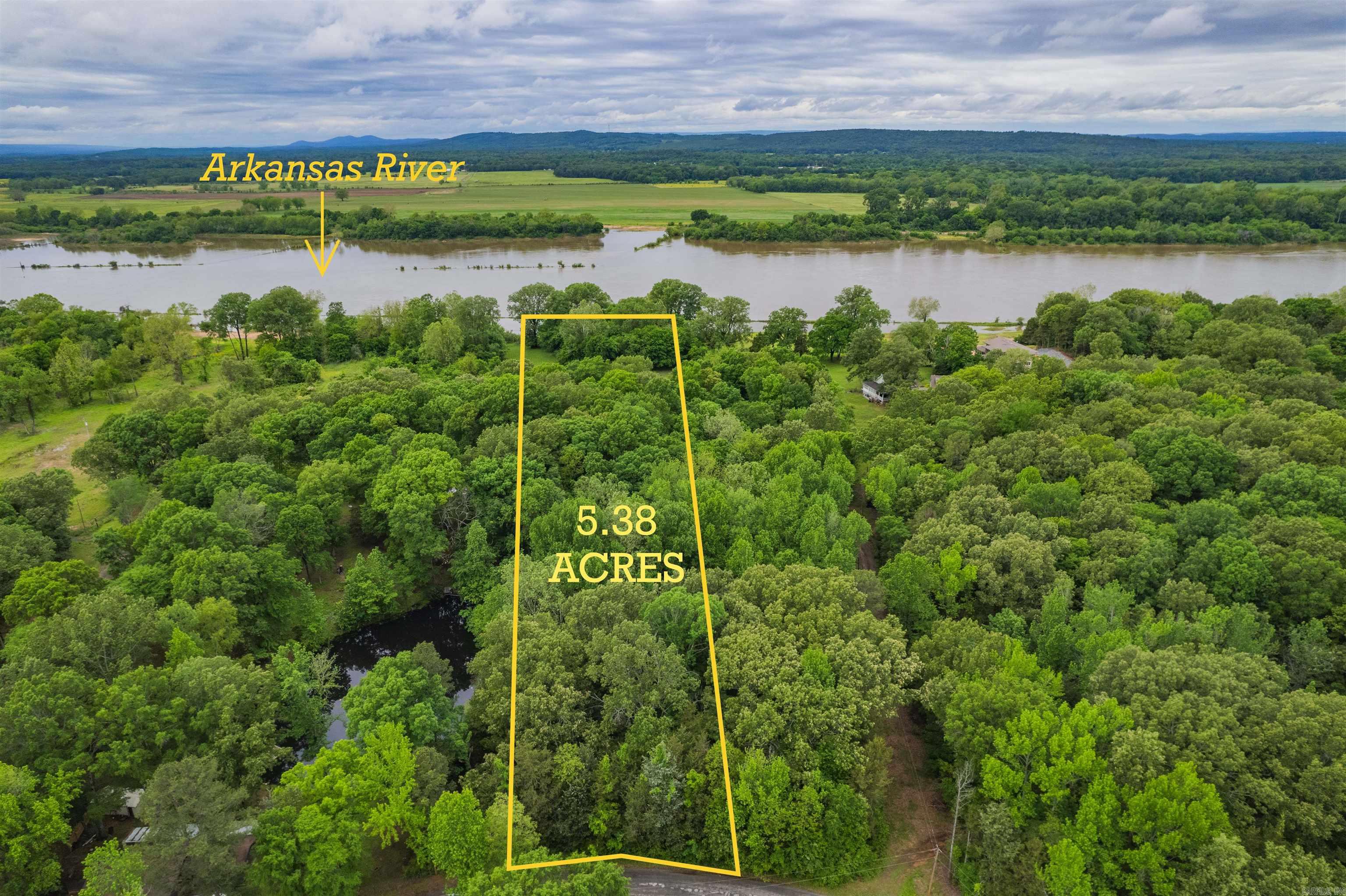 BUILD YOUR DREAM HOME on the Arkansas River!! Looking for your own slice of heaven on the Arkansas River this is the property for you. Discover a rare opportunity to own this pristine, clear, waterfront land with 175 feet of unobstructed AR River frontage. This breathtaking, panoramic view is the perfect place to create your ideal home, whether it's a peaceful retreat or a luxurious river estate. This level building site is ready for construction and offers plenty of privacy. Ideal location for boating, fishing and other water activities. Toad Suck Marina is just minutes away, offering boat slips, fuel and easy access to the river. This is the perfect place to embrace waterfront living and own a piece of Arkansas River Paradise!