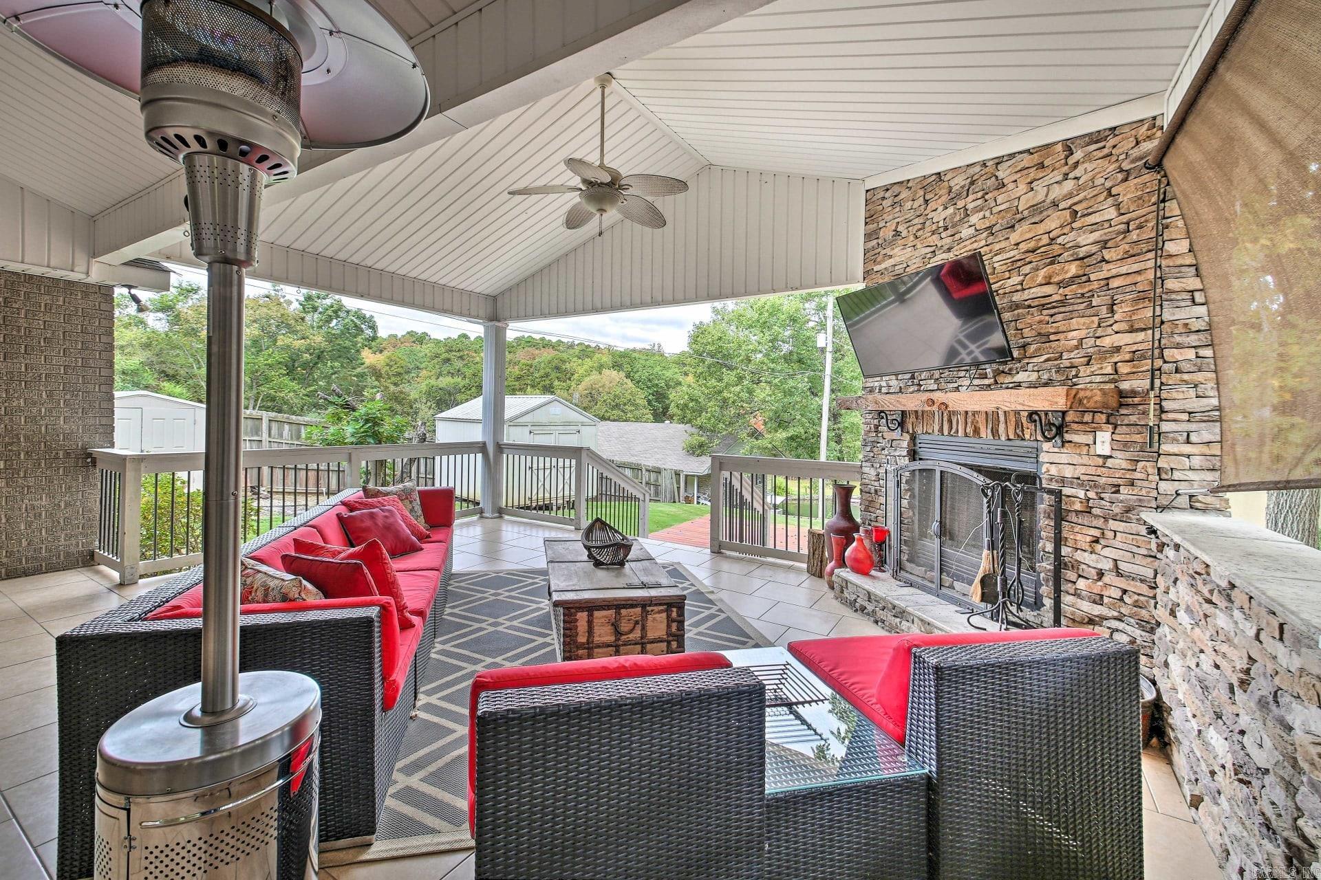 Welcome to 205 Gleneagle Loop, a stunning lakeside retreat that defines luxury living. This fully furnished residence boasts 4 bedrooms, 2 1/2 bathrooms, and is strategically located directly on the picturesque Lake Hamilton. Enjoy the convenience of a private boat dock with a lift, making water activities a breeze. The property has served as a successful vacation rental, generating an impressive average of over $80,000 a year in rentals over the last two years. The outdoor space is a true haven, featuring a large covered area with an outdoor kitchen, wood-burning fireplace, and a TV ā perfect for entertaining or simply unwinding with a view. This gorgeous home is impeccably updated with beautiful decorations and furnishings, creating an inviting atmosphere throughout. With parking space for up to 6 vehicles in front of the house, this residence is not just a home; it's a lifestyle. Don't miss the chance to make 205 Gleneagle Loop your own piece of lakeside paradise.