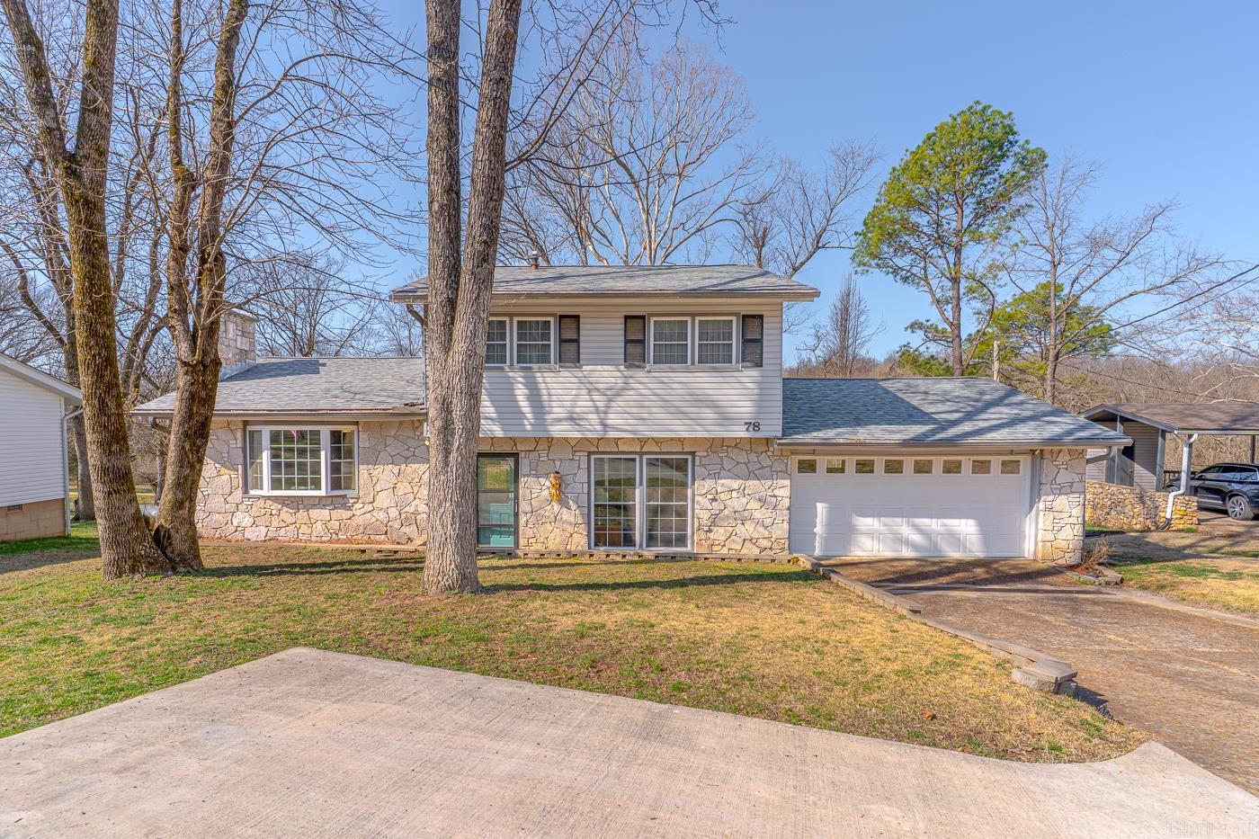 Welcome to Market 78 Altakima Circle of the Kima 2nd Sub. in Cherokee Village, AR. Situated on a .34 +/- acre cul-de-sac lot near the South Fork of the Spring River is a renovated home wrapped in stone & vinyl, topped w/ architectural shingles, and accented by shutters, gutters, 2 car garage, sunroom, gorgeous front door with side-lite, and beautiful landscaping. The interior holds 2,112 sf of well laid out space over 2 floors. The main level features the living room, dining room w/ ventless gas fireplace, kitchen w/ stainless steel appliances, granite countertops, backsplash, pantry, peek-a-boo cabinets, island w/ seating, and access to the sunroom w/ tree-lined views. The Master wing contains a built-in desk, laundry room, and Master w/ walk-in closet, access to the deck, and en-suite w/ dual vanity and tiled walk-in shower. Upstairs is a 2nd Master w/ en-suite that holds a shower/tub combo and vanity, 2 guest bedrooms, and guest bathroom w/ walk-in shower. You'll love the hardwood floors, under cabinet lighting, 12x10 outbuilding, French Drain, extra parking pad, and all the amenities the village has to offer. Call today to make this house your home or home away from home.